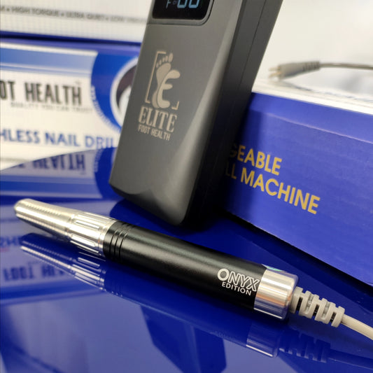 Close-up of a stainless steel handpiece and nail drill control unit against a blue backdrop with the Onyx nail drill box blurred behind—showcasing podiatry instruments, podiatry equipment for sale, chiropodist equipment for sale, podiatrist nail drill, podiatry tools, and foot care supplies.