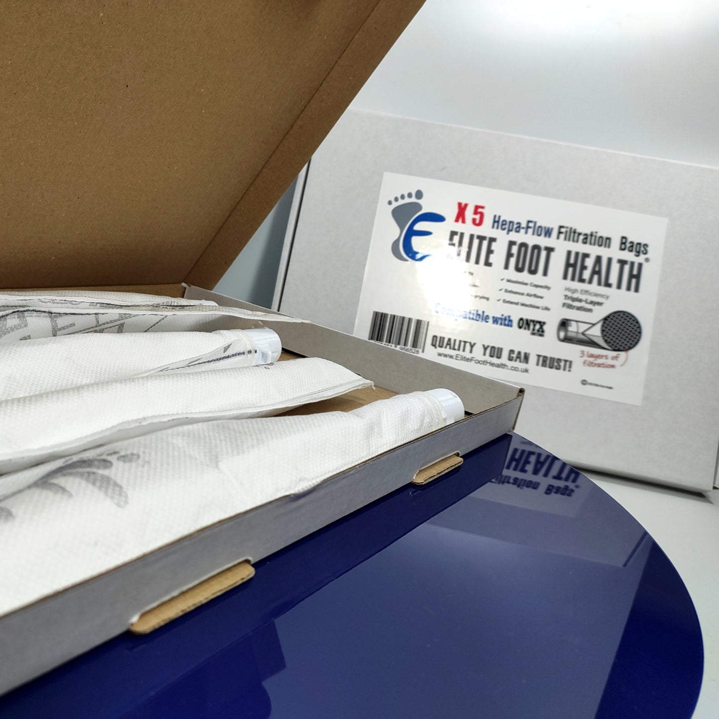Box containing health-related items with a label for 'Elite Foot Health' on a white background.