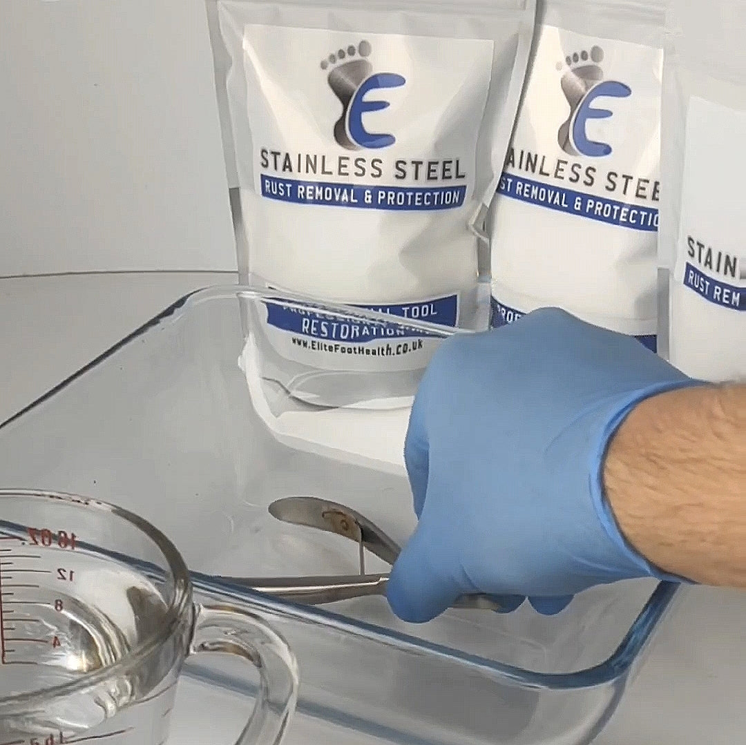 example of submersing a stainless steel tool using blue latex gloves