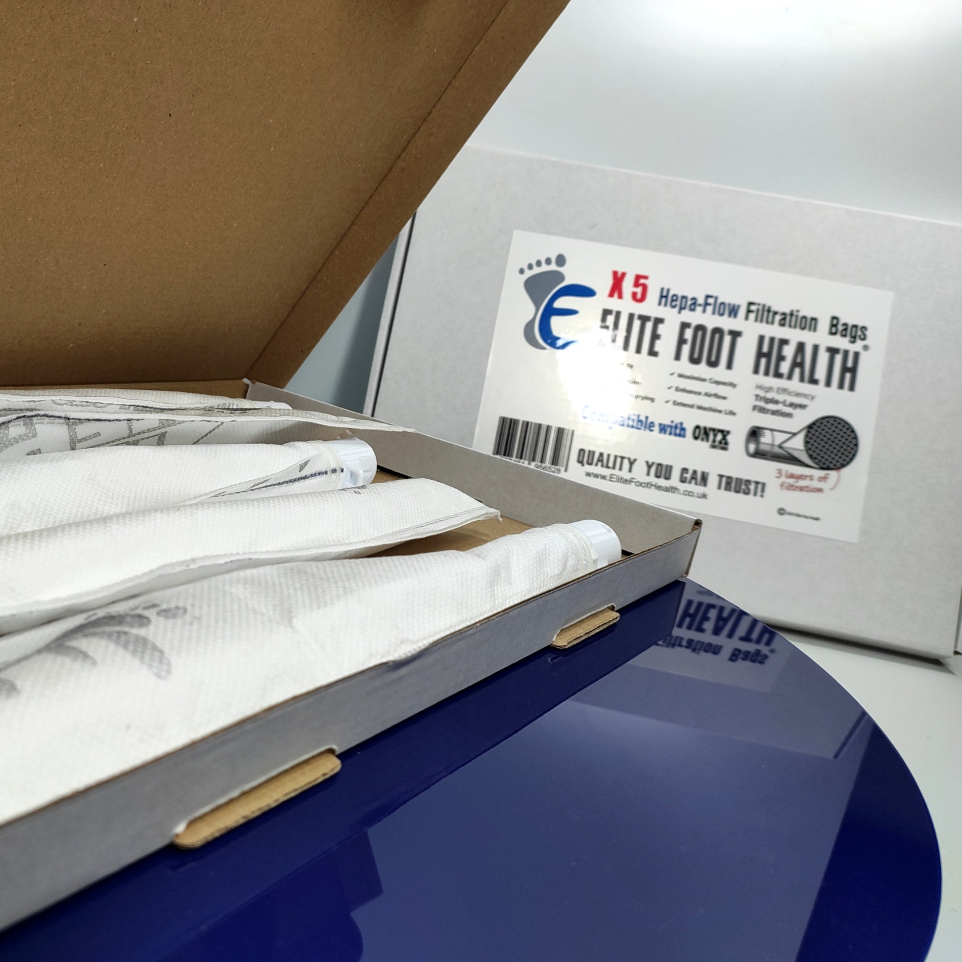 Box containing health-related items with a label for 'Elite Foot Health' on a white background.